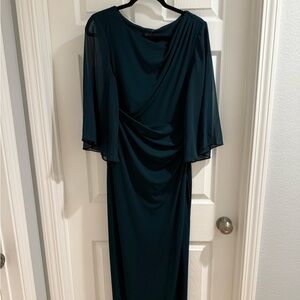 Emerald green gown with sheer sleeves and shirred bodice for flattering fit